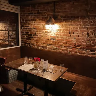 Dark, rustic speakeasy feel.