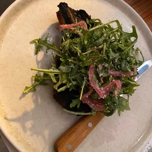 Rib pork chop and arugula salad