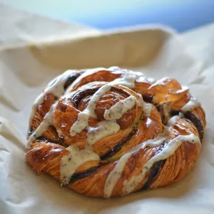 a croissant pastry on a piece of wax paper