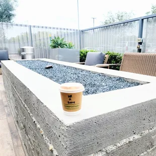 a cup of coffee on a patio