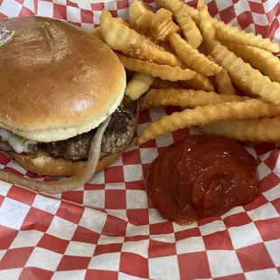 Steak burger with grilled onions and French Fries