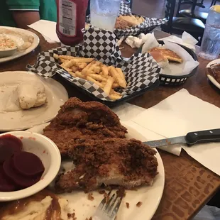 a plate of fried chicken and fries