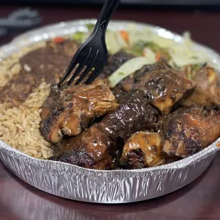 a bowl of food with rice and meat