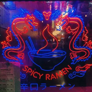 a neon sign for spicy ramen
