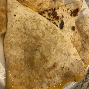 One huge triangle, one little triangle and two random rectangles, barely any chicken at all