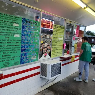 a man standing in front of a store
