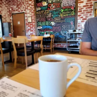 a cup of coffee on a table