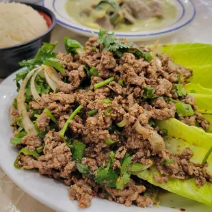 beef larb salad and beef green curry with a side of sticky rice