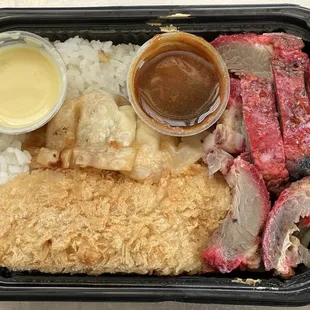 $5 Bento. Rice, fish, mandoo and char sui with sauces.