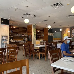 a man sitting at a table in a restaurant