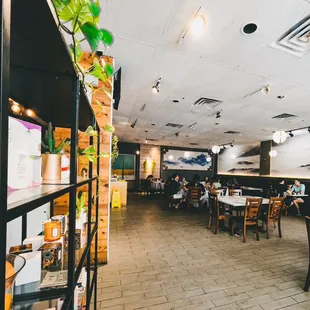 a restaurant with tables and chairs