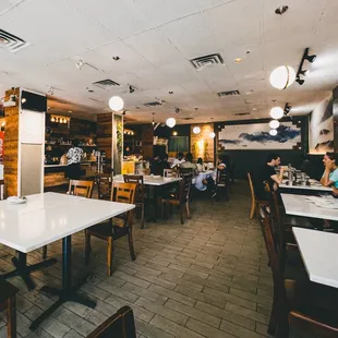 a restaurant with tables and chairs
