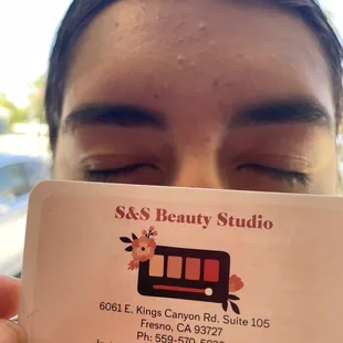 Brow Wax but she also threads a few spots.