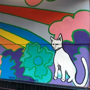 a cat painted on a wall