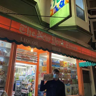 a man standing in front of a store