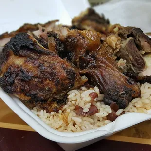 Jerk Chicken, yams, rice and peas. This food hit the spot.