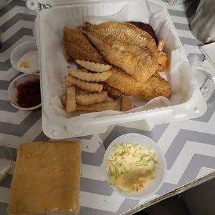 fish and fries in a styrofoam container