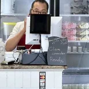 a man behind a counter
