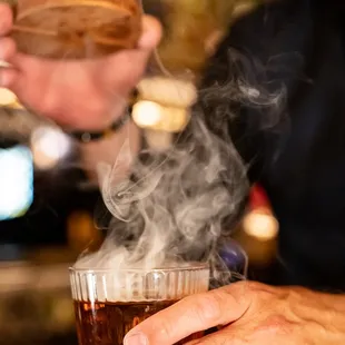 a person holding a drink