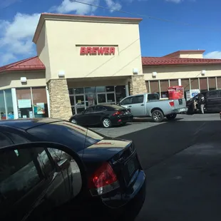 cars parked in front of a store