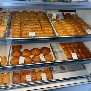 a display case filled with various types of donuts
