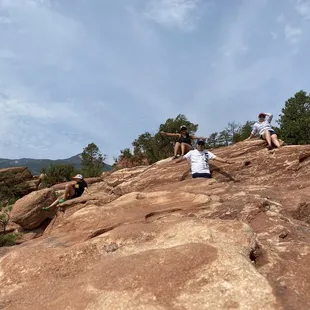  a group of hikers on a rocky outcropping