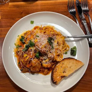 a plate of pasta and bread