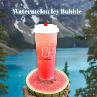 a hand holding a watermelon