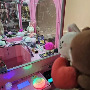 Let&apos;s play the claw machine game... there&apos;s a bunny in the corner!