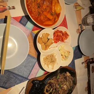 Spicy rice cake, bulgogi, not sure why we get different sides compare to the other table