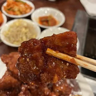a plate of food with chopsticks