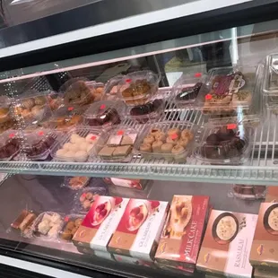 a display case filled with assorted pastries