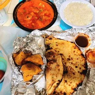 Onion Naan ,goat roganjosh, vegetable samosas basmati rice and dessert