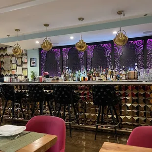 a bar with a lot of chairs