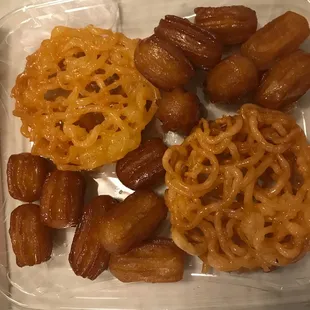 Zulbia and baamieh. Persian version of funnel cake and churro soaked in syrup. Yum
