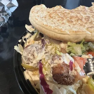 Pita bread (so soft and good) falofil (freshly made) and lots of hummus and salads. Their hot sauce is delicious too.