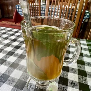 a cup of tea with a spoon in it