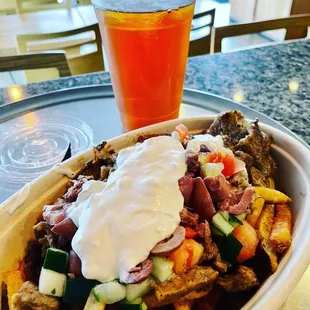 French get base, gyro meat and veggies with taziki