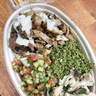 a large platter of food on a wooden table