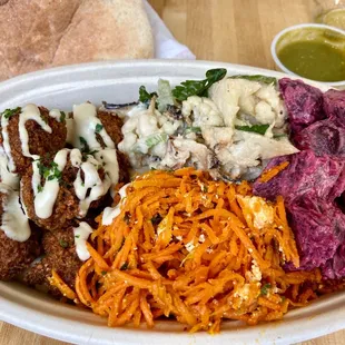 Falafel bowl with Roasted Cauliflower, Moroccan Carrots, Roasted Beets