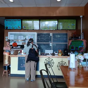 a woman standing at the counter