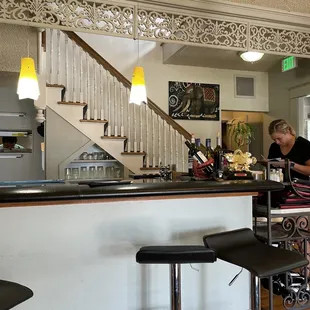 a woman sitting at a bar