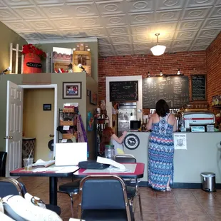 The decor is perfect for a small, brick building turned into a coffee shop.