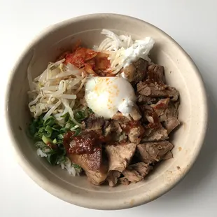 Good pork to rice ratio, topped with sprouts, pickled daikon, green onion, and Kim Chee