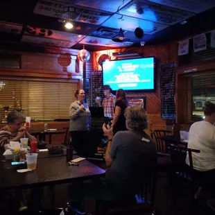 a group of people sitting around a table