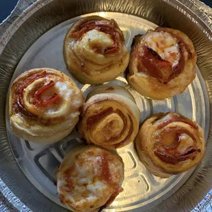 a plate of mini pizzas on a table