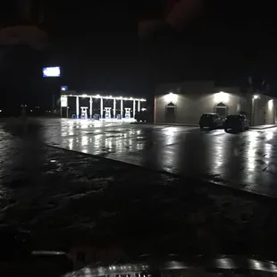 Parking lot of the fuel stop. It has gas and diesel pumps. Deli- Hunts pizza made to order.