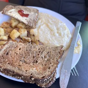 Home cooked potatoes and cheesy grits.
