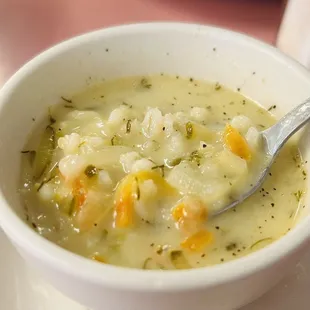 a bowl of soup with a spoon