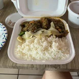 a meal in a styrofoam container